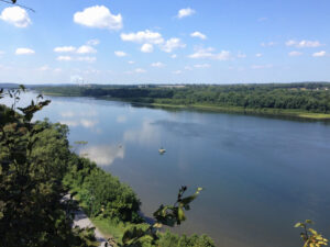 River view from bluff with blue sky and clouds. 